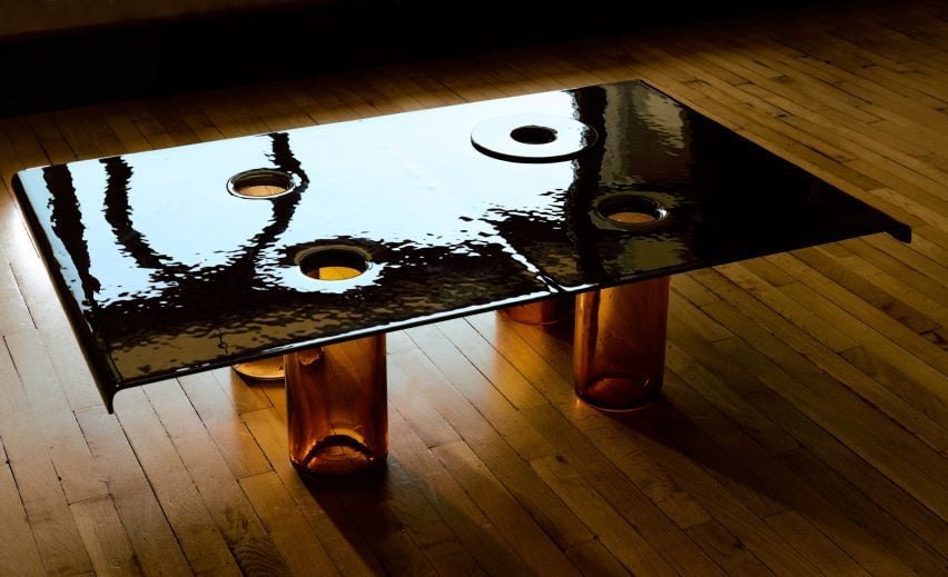 Image depicting a rippled glass table that showcases the craftsmanship honed during the designers’ residency.