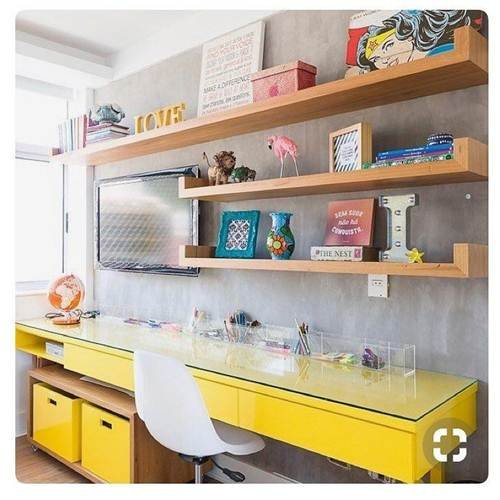 image of a yellow desk with a glass top adding brightness to the space