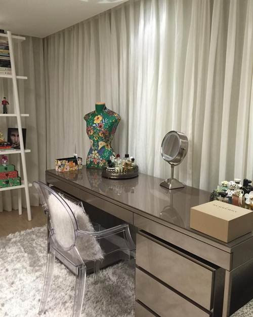 image of a sophisticated grey metallic desk displayed on a white fluffy carpet