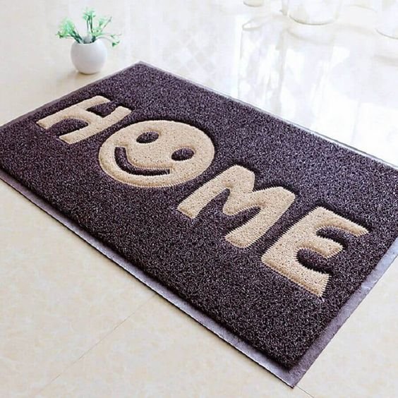 Using a smiling face instead of an 'O' in the word 'Home' conveys a happy, welcoming home for joyful people.