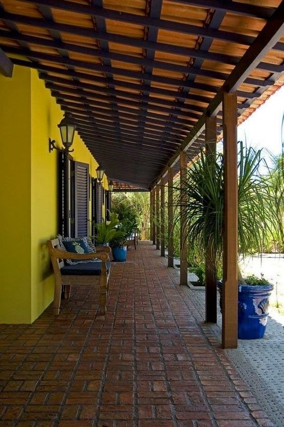 Image of a porch area with sofas and chairs for family gatherings.