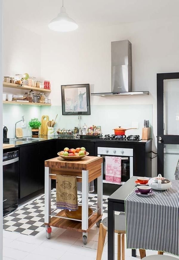 A monochromatic kitchen emphasizing black cabinetry