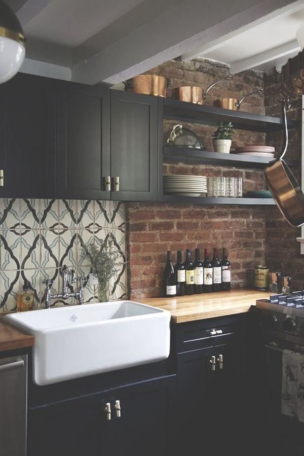 A kitchen showcasing a mix of black and contrasting colors