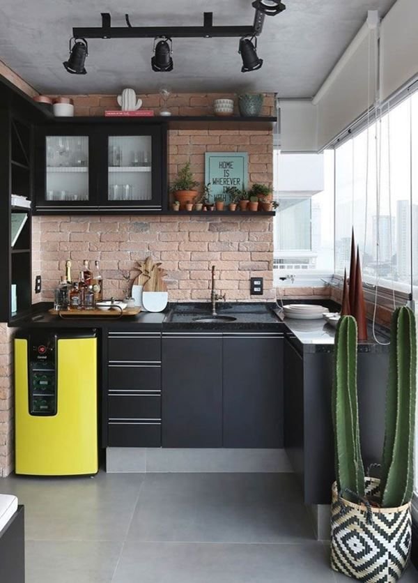 A rustic kitchen featuring black cabinets