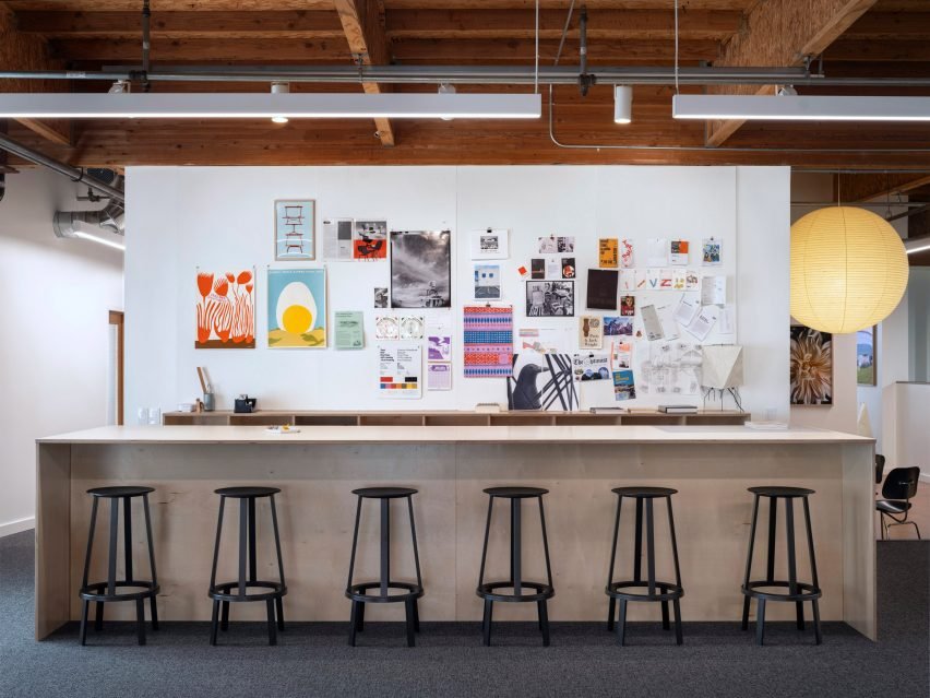 Bar area with black bar stools, enhancing the modern yet vintage design aesthetic.