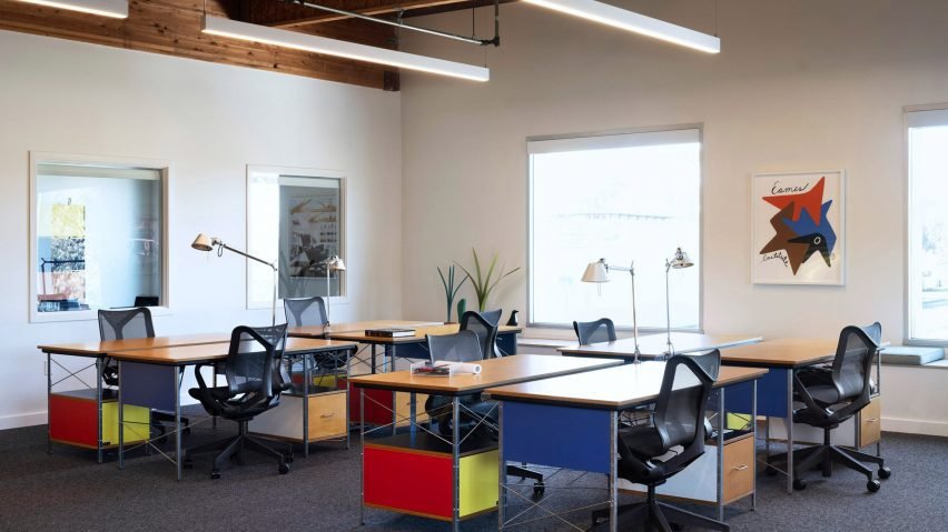 Eames Institute headquarters renovation featuring a striking façade and lush surroundings.