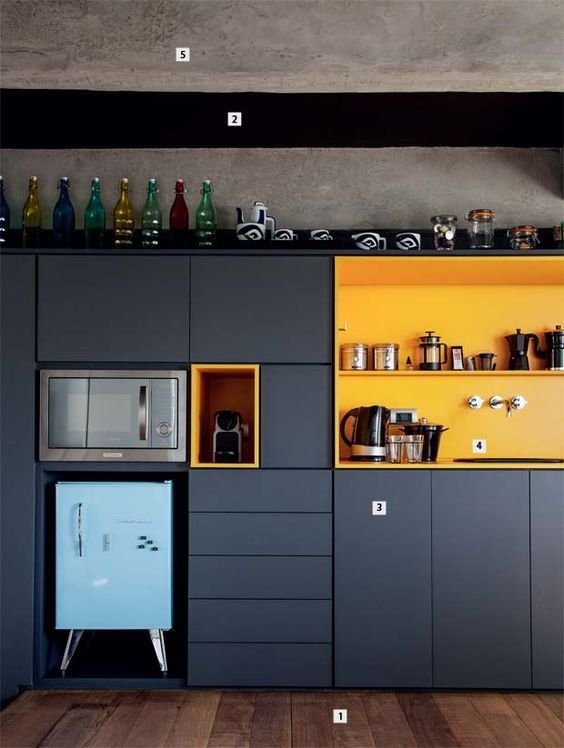 A kitchen with brighter-colored niches gains more life and joy, with yellow being a prominent color that appears in other details.