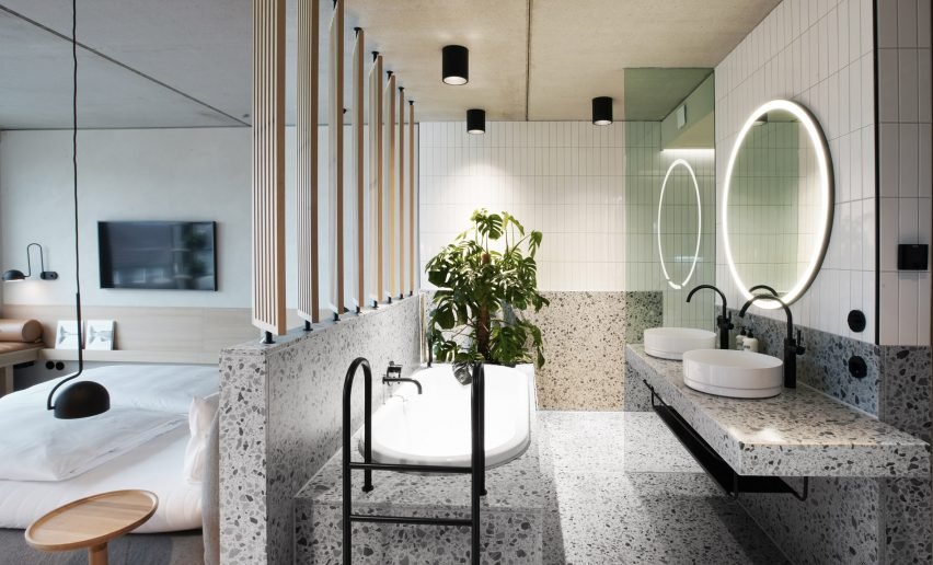 Bathroom interior with custom-made towel rails from Studio Aisslinger.