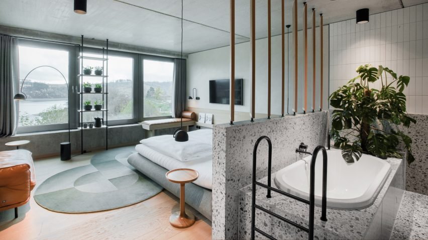 A renovated bedroom interior featuring terrazzo and wood.