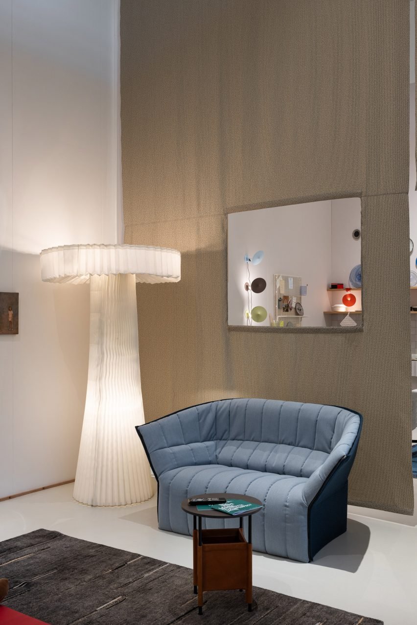 The pleated PO/202 floor lamp, launched in 2002, features in the living room along with other traces of domestic life.