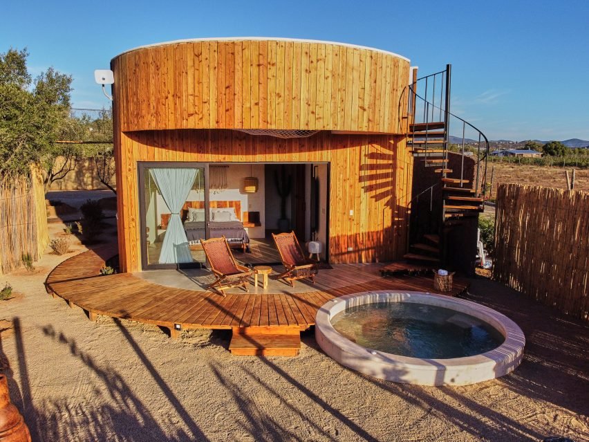 Interiors of a cabin featuring a plunge pool, blending indoors and outdoors.