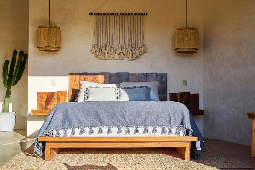 Bedroom features a unique design in a circular cabin.