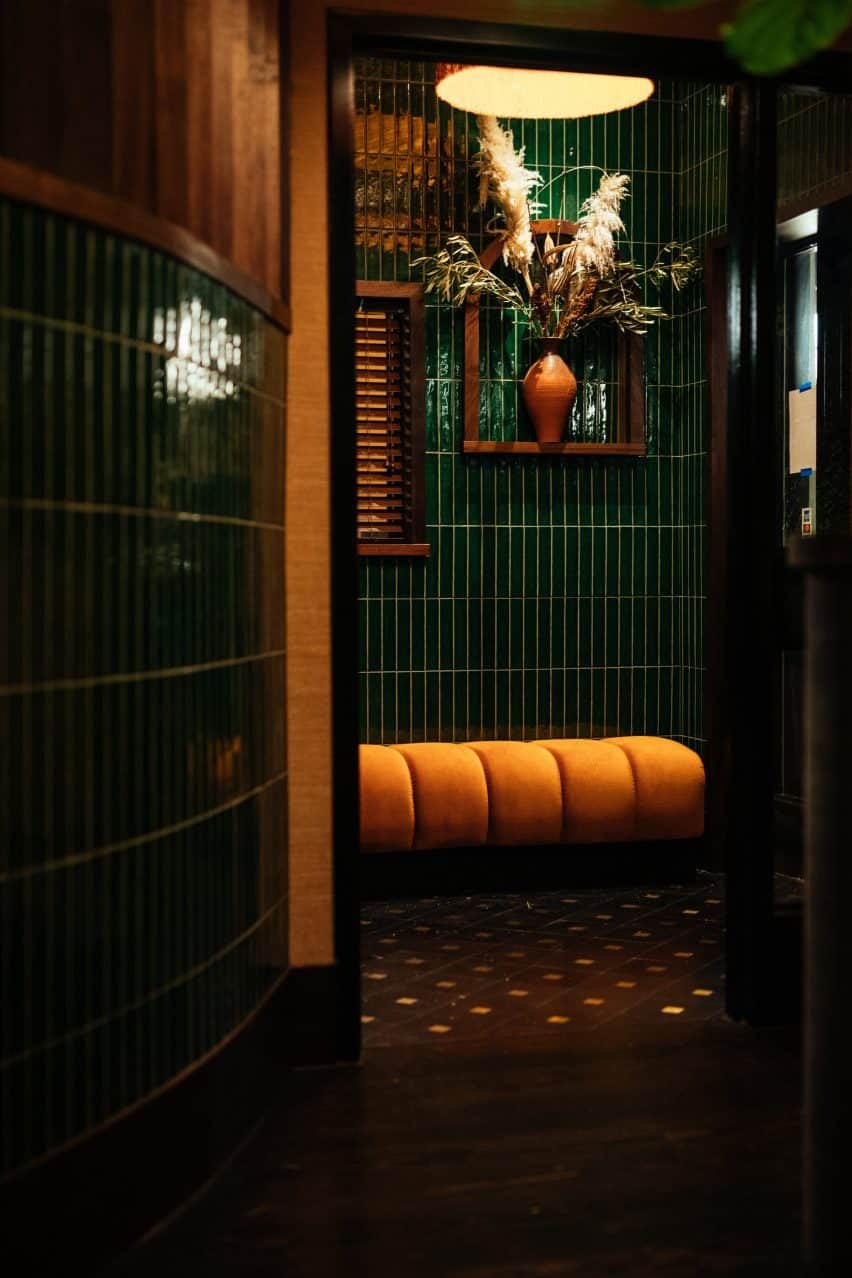 The dark entrance leads into a curved passage, through to the dining room.