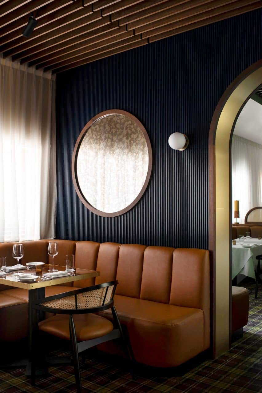 Navy fluted walls form the backdrop to the salon.