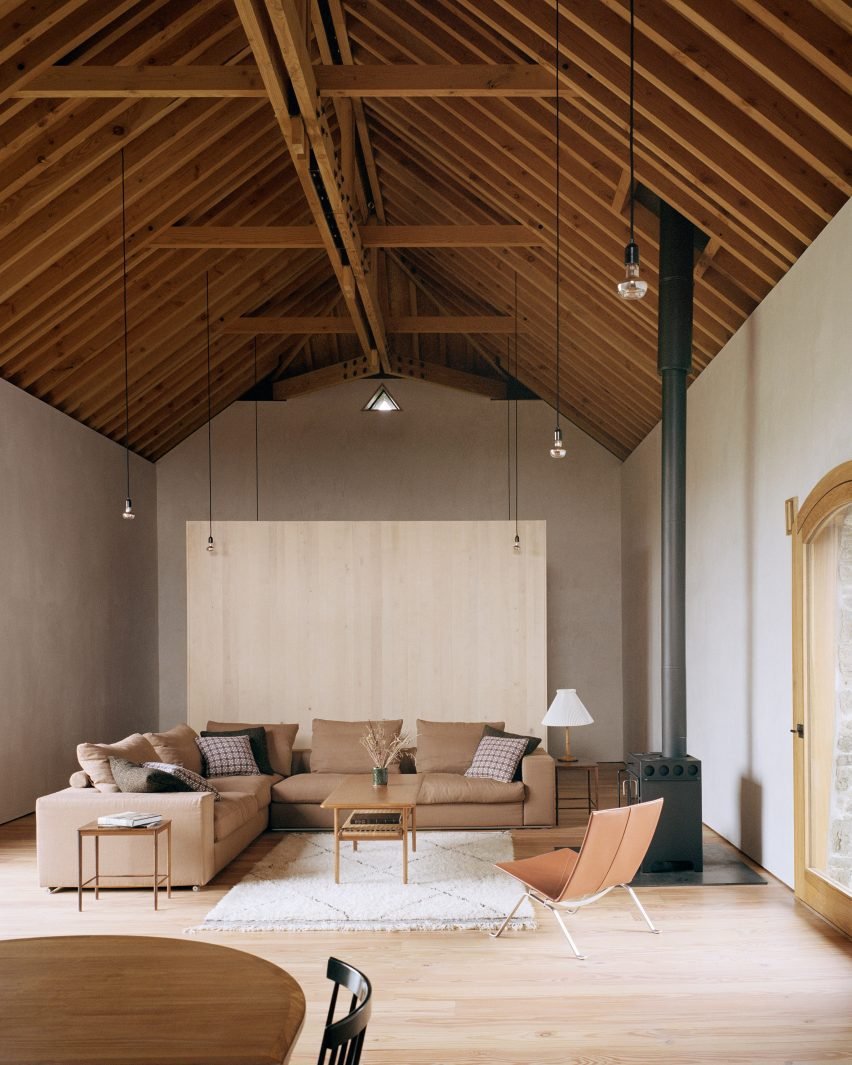 Redhill Barn, UK, by TYPE: A secluded house maintaining its 200-year-old stone walls with a neutral interior to complement its architecture.