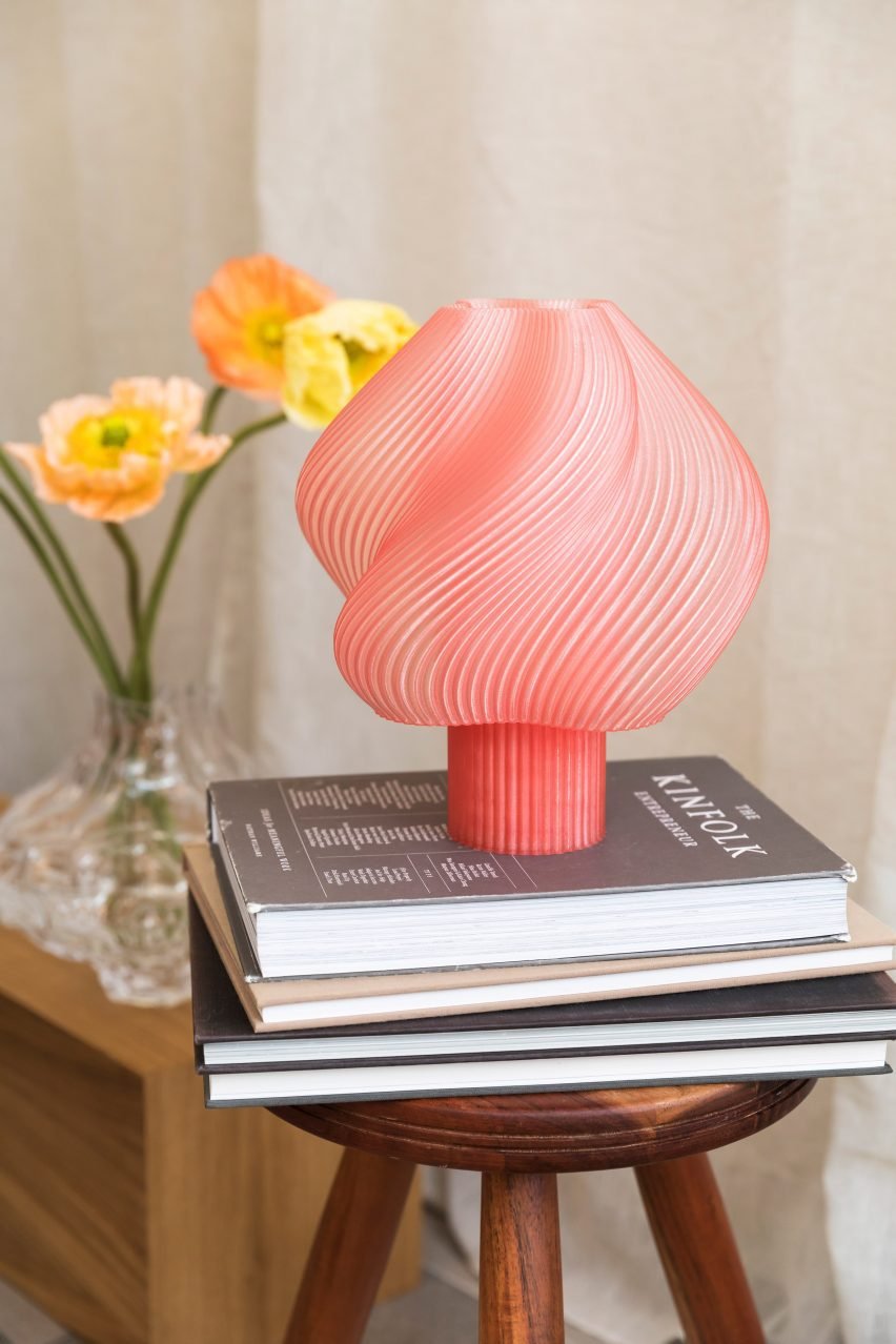 The Soft Serve lamp, crafted to resemble swirly ice cream, showcases innovative bioplastic design in soft colors.