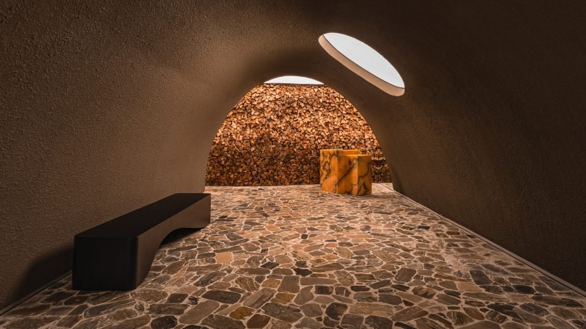 Cavernous restaurant interior designed to resemble earth ovens used for cooking.