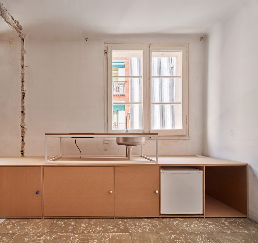 Photo of 10K House in Spain, featuring a raw, pared-back interior aesthetic with visible dismantled fixture traces.