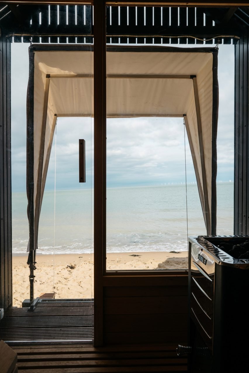 Haeckels-designed sauna in Margate, inspired by Victorian bathing machines, featuring a wood-burning stove and a sea view.