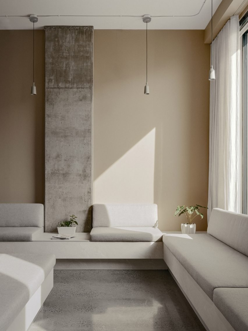 The dental clinic features a reception desk clad in off-white ceramic tiles.