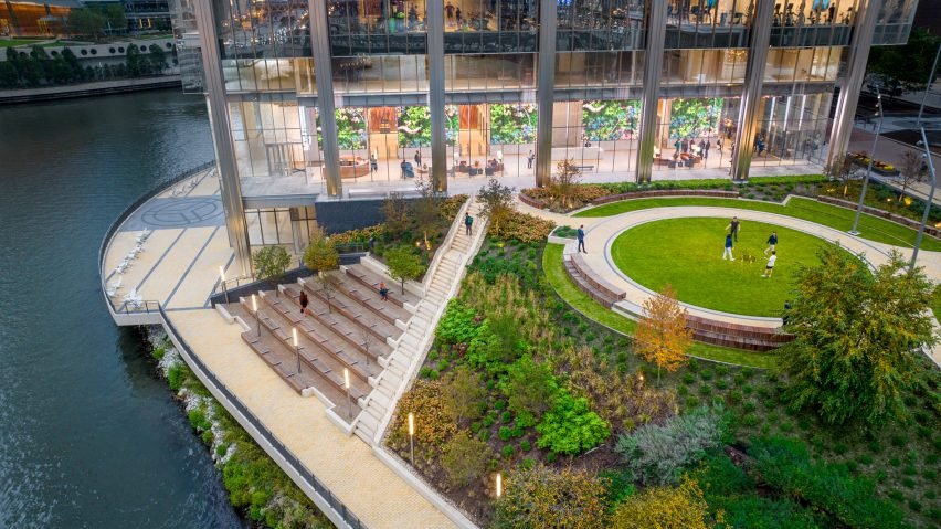 A park next to the skyscraper along the riverfront