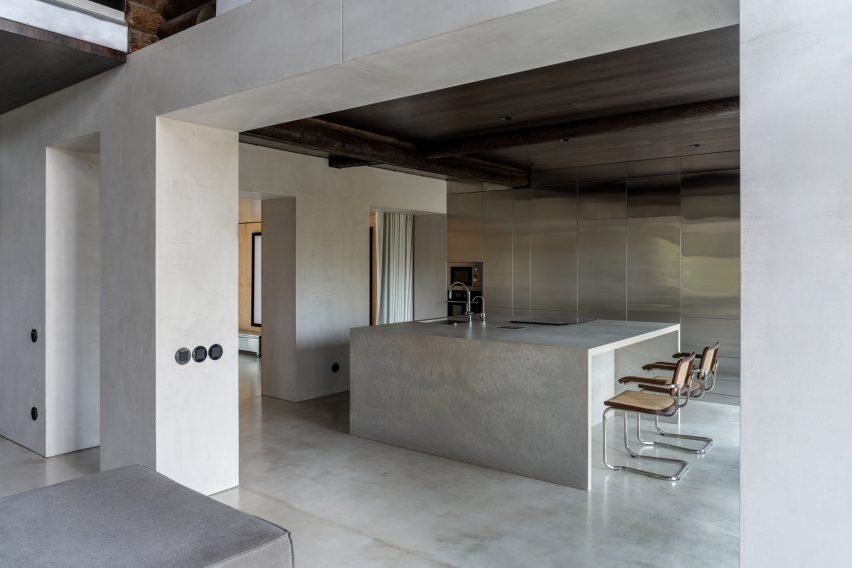 Photograph of concrete and stainless steel kitchen