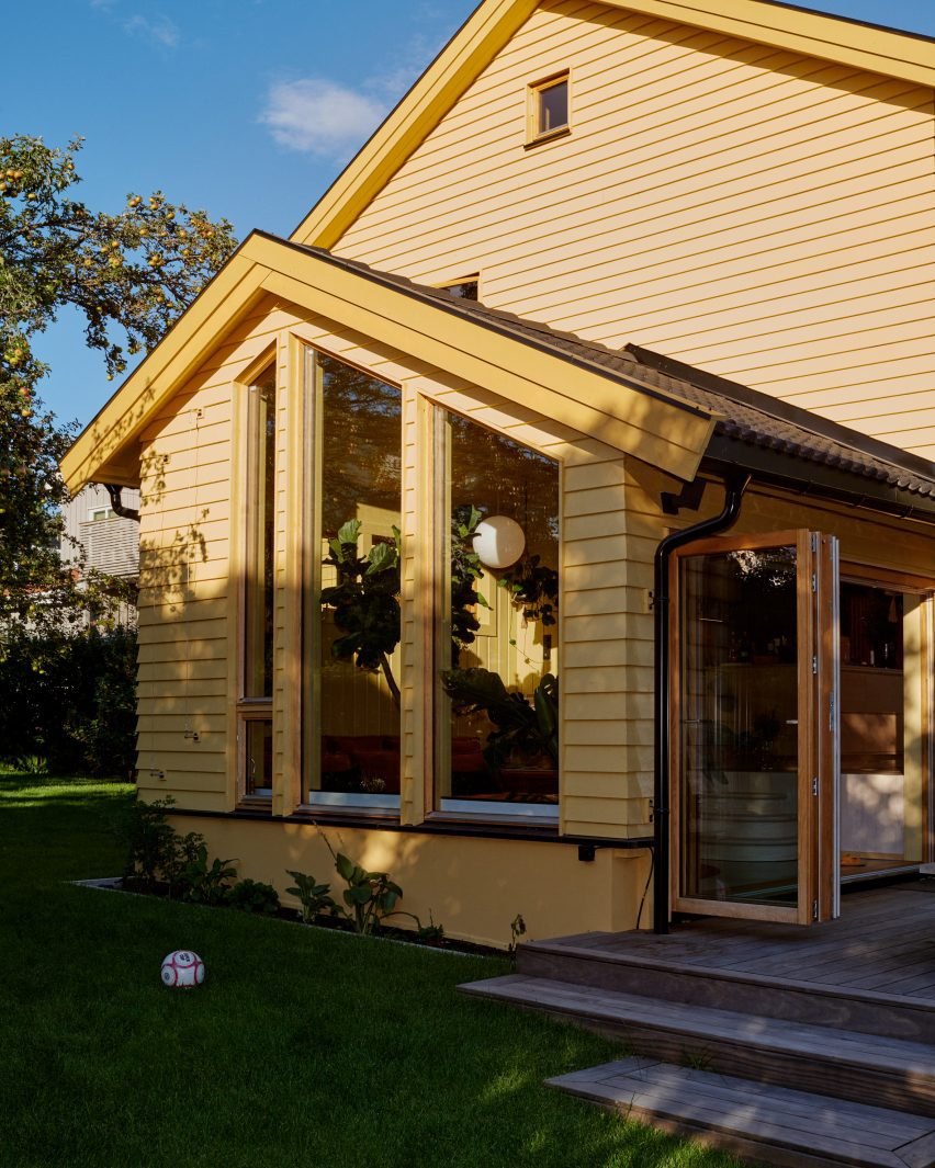 Yellow House in the Apple Garden by Familien Kvistad.