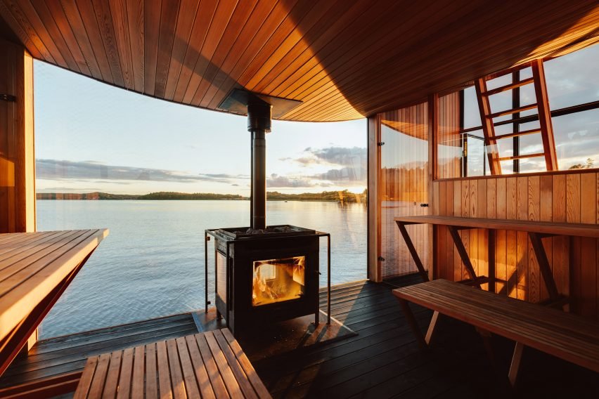 The Big Branzino, a floating sauna with a distinctive bow-shaped roof by Sandellsandberg, located in the Stockholm archipelago.