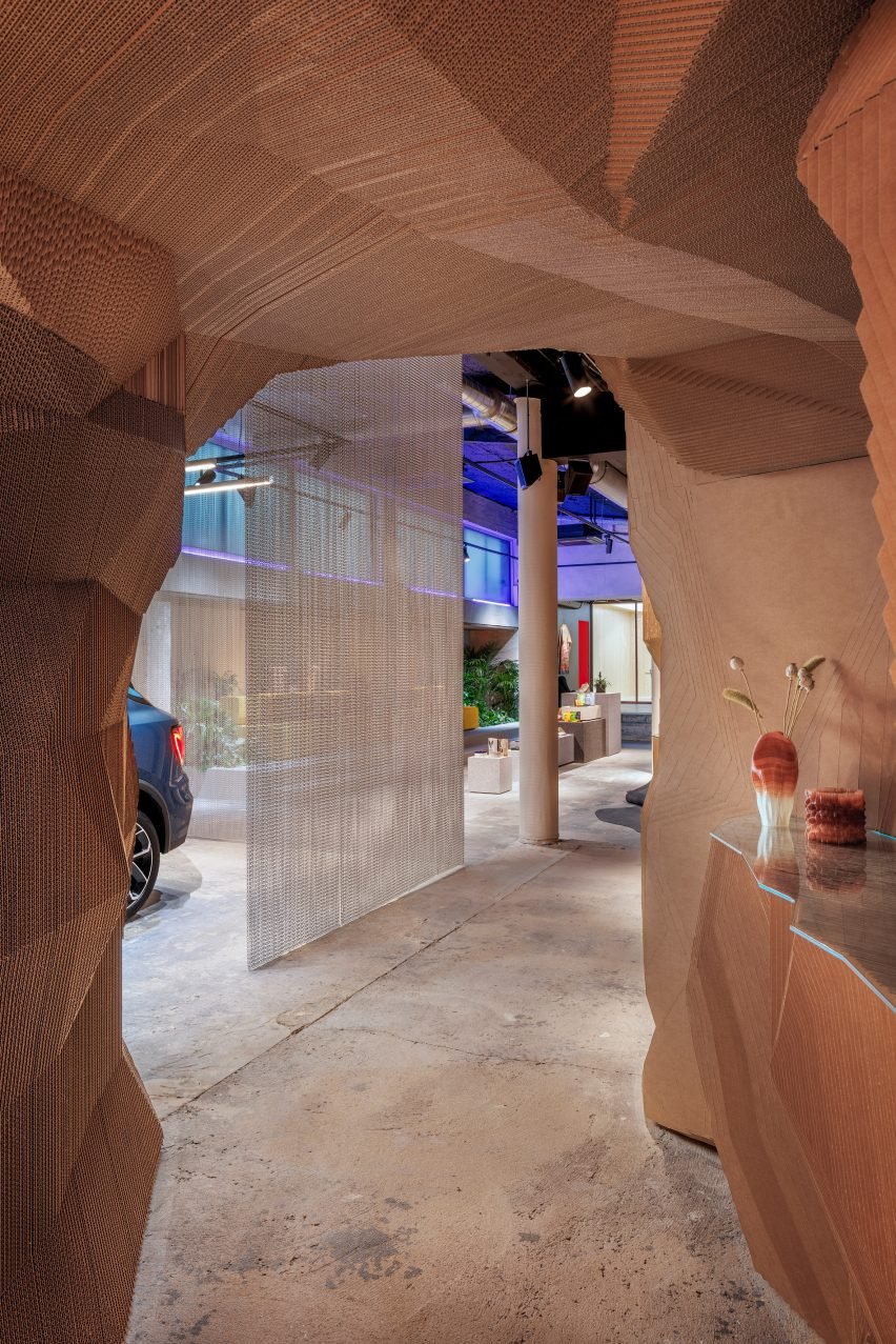 Cave-like space made of laser-cut sheets of cardboard.