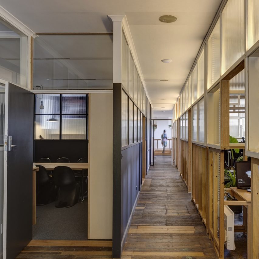 Interior view of the office highlighting the wooden framework retained from the previous fit out.