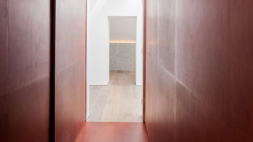 Leather-lined wardrobes designed by Simon Astridge, featuring an eye-catching center in a refurbished London house.