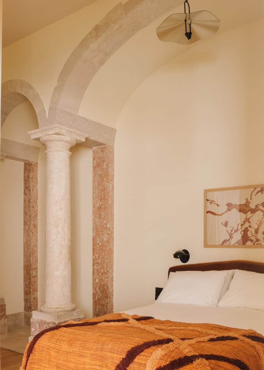 Bedroom with archways and pillars in the Locke Lisbon.