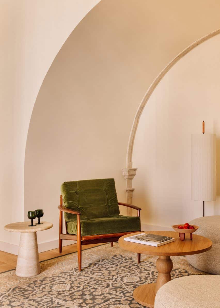 Green chair in minimal interior by Post Company.