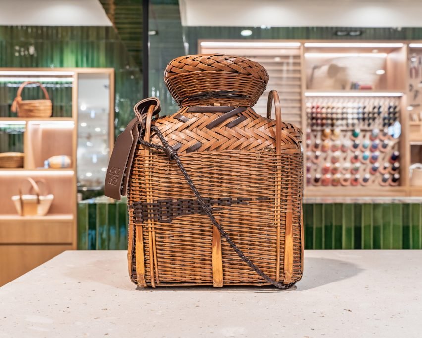 Display of unique Loewe bags crafted from surplus leather, showcasing the commitment to sustainability.